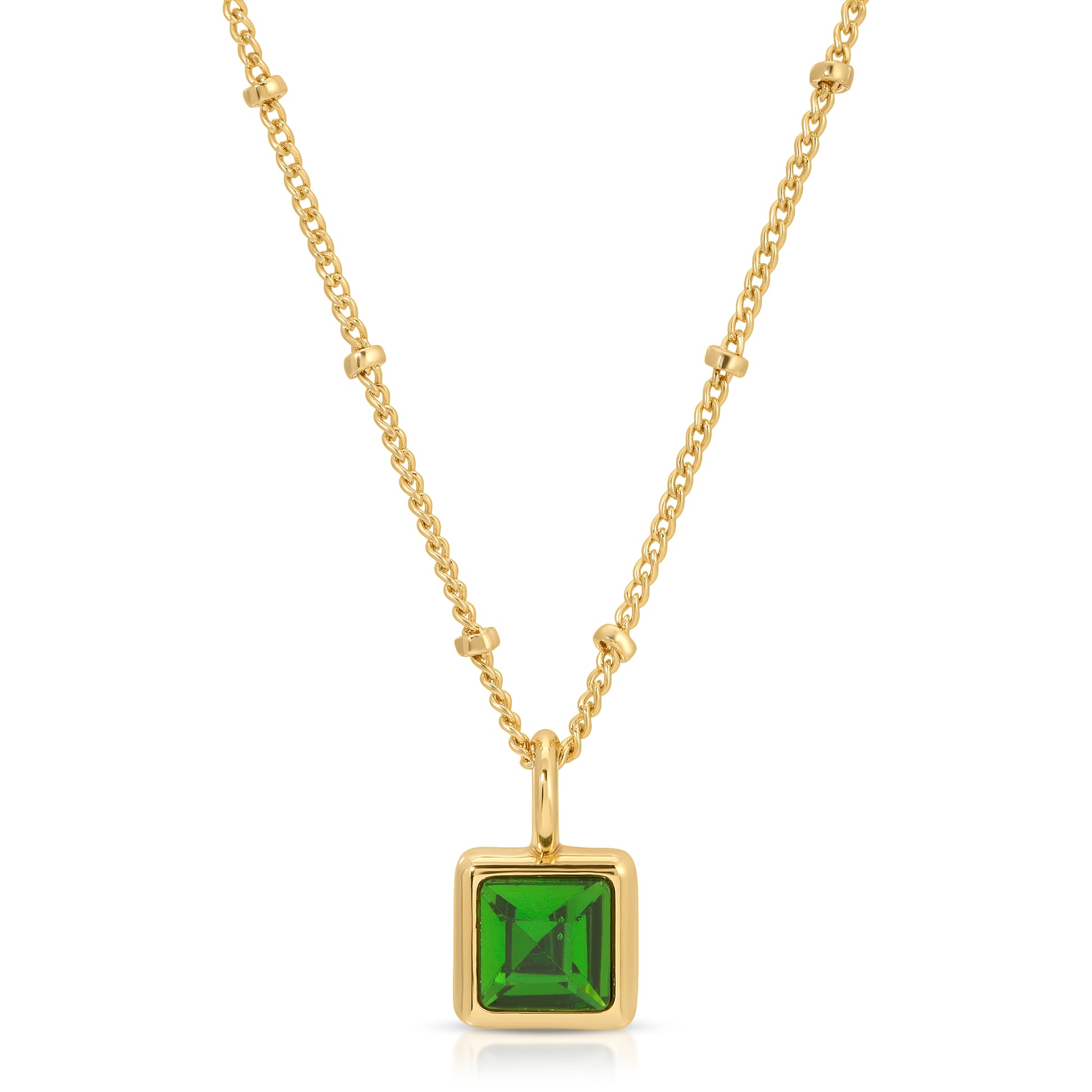 A gold chain necklace features a square green gemstone pendant.