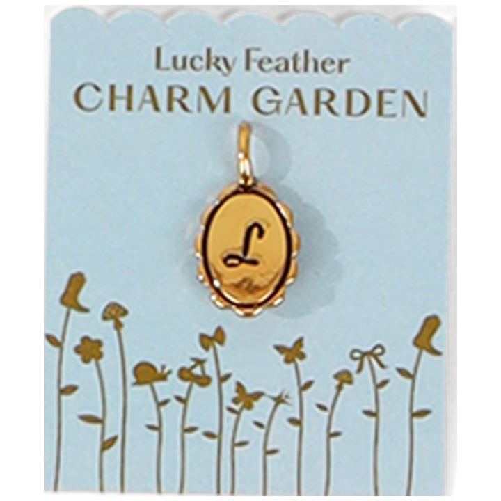 The image shows a 'Lucky Feather Charm Garden' card with an oval gold charm bearing the letter 'L'.