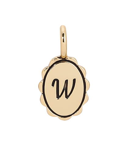 A gold charm with a scalloped edge features a cursive letter "W."