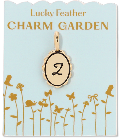 A "Lucky Feather Charm Garden" tag displays a charm with the letter "Z" on a light blue background with a garden design.
