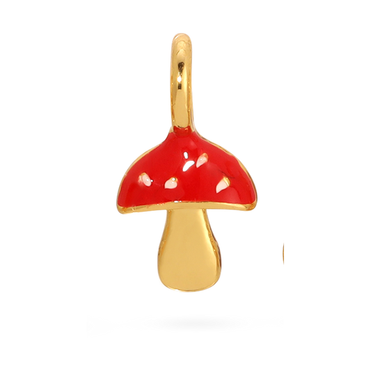 A gold mushroom charm with a red cap is against a black background.