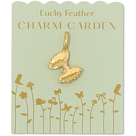 The image shows a gold butterfly charm on a 'Lucky Feather Charm Garden' card with floral accents.