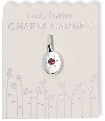 A "Lucky Feather Charm Garden" jewelry charm on a display card.