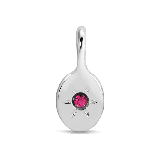 Close-up of a silver pendant with a pink gemstone.
