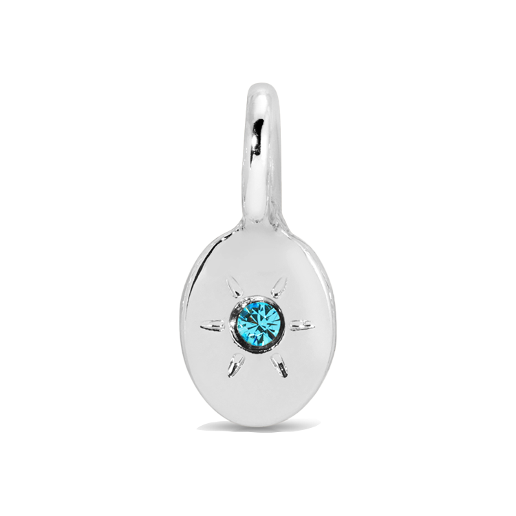 A silver charm with a blue gemstone.