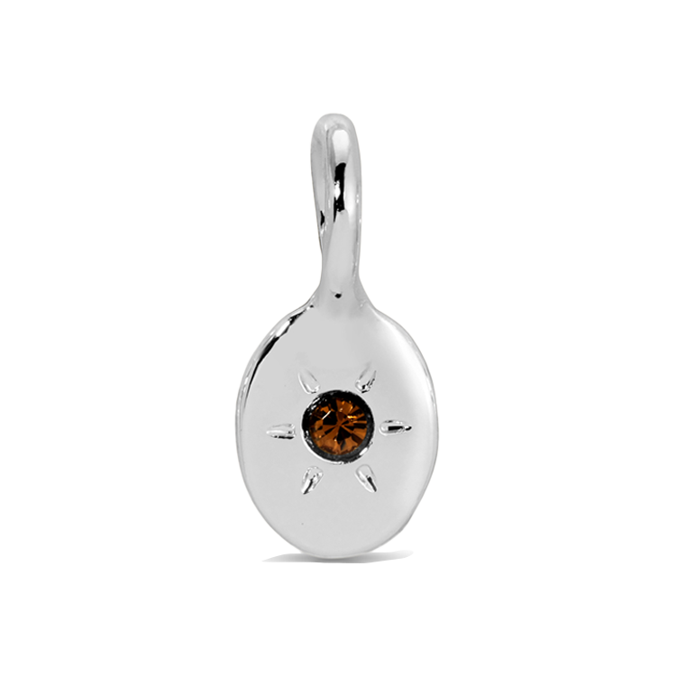 A silver charm with a brown jewel-like stone in the center is displayed.