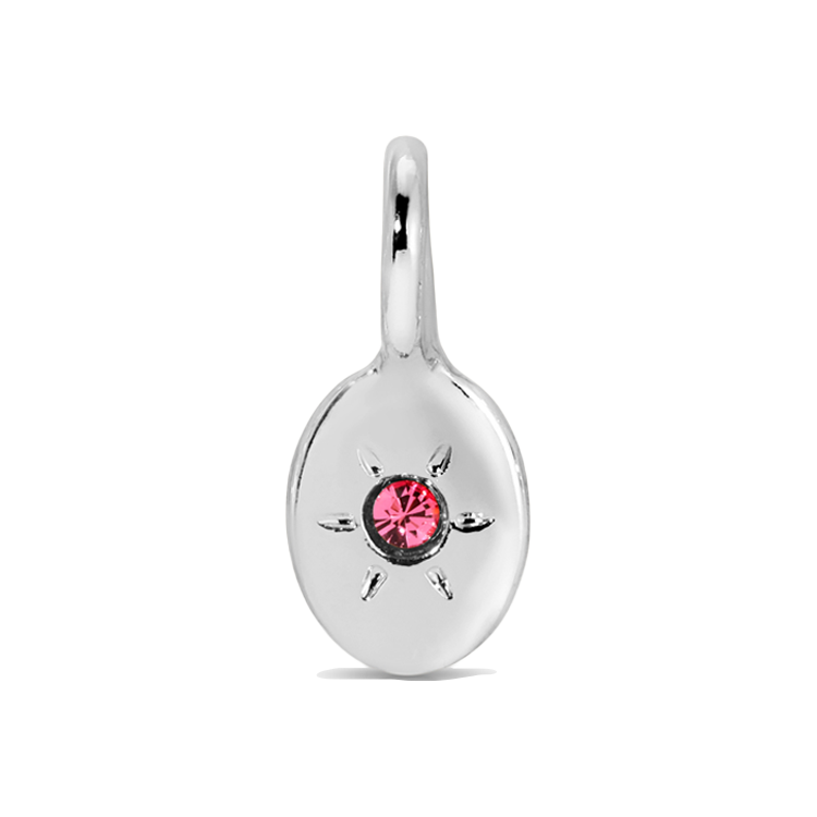 A silver charm with a pink gemstone.