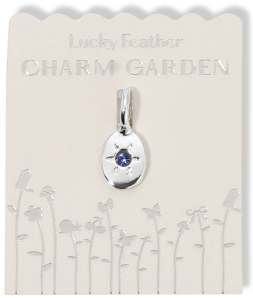 A "Lucky Feather Charm Garden" pendant is displayed on its card.