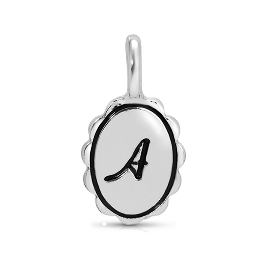 Close-up of a silver pendant with an ornate oval shape and the letter 'A' in black.
