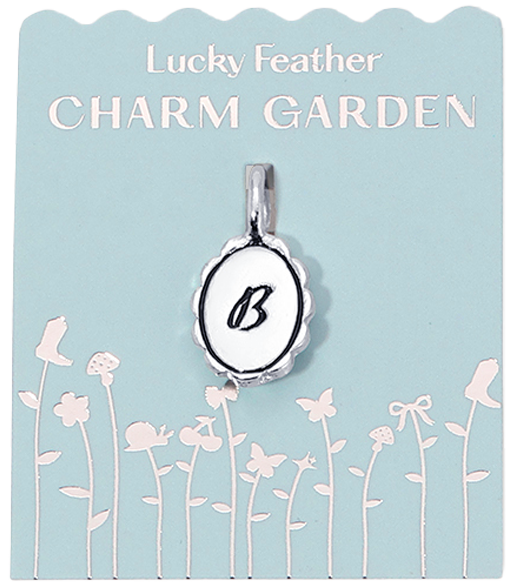 A "Lucky Feather Charm Garden" pendant with the letter "B" on a blue card with a floral design.