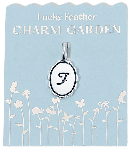 A "Lucky Feather Charm Garden" tag displays a charm with the letter "F" against a pale blue background decorated with silhouettes of garden elements.