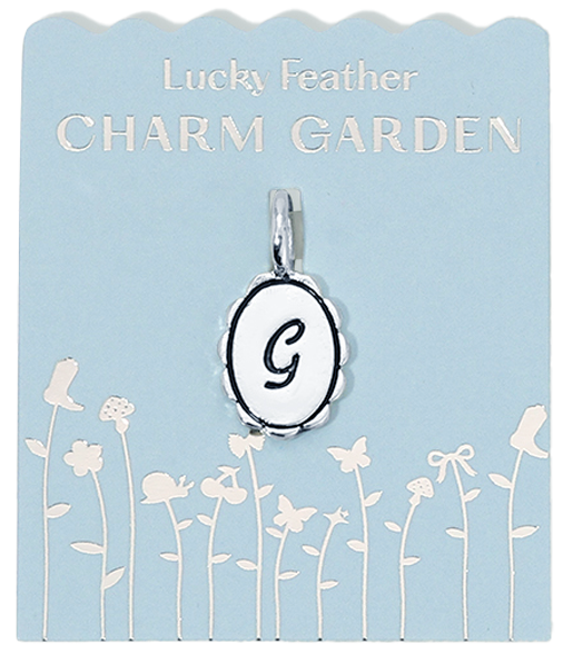 Lucky Feather Charm Garden display card with a "G" pendant.