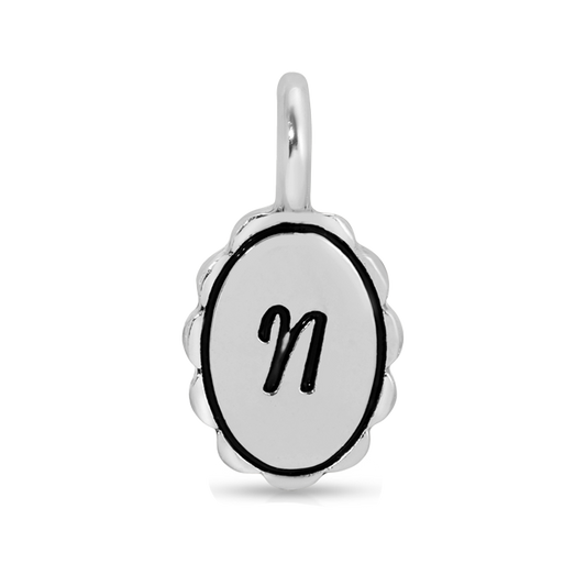 A silver pendant with the letter 'n' on it.
