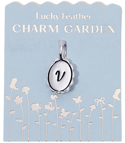 Silver initial "V" charm from the "Lucky Feather Charm Garden" collection, displayed on a light blue floral background.