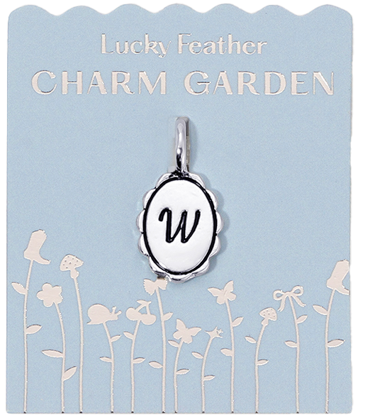 Lucky Feather Charm Garden card featuring an oval pendant charm with the letter "W" on a blue background with a garden design.