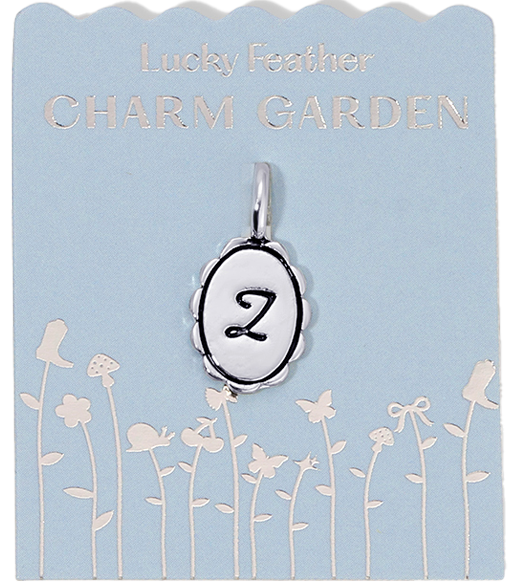 An initial "Z" charm on a card that reads "Lucky Feather Charm Garden".