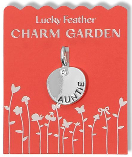 A silver "Auntie" charm on a red "Lucky Feather Charm Garden" display card with a silver floral design.