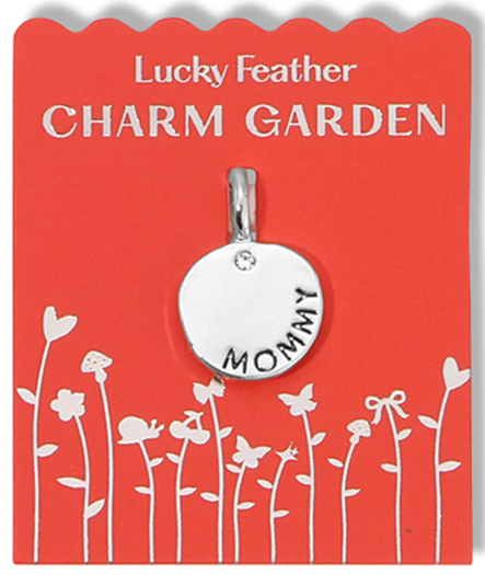 A "Mommy" charm hangs on a red card labeled "Lucky Feather Charm Garden."