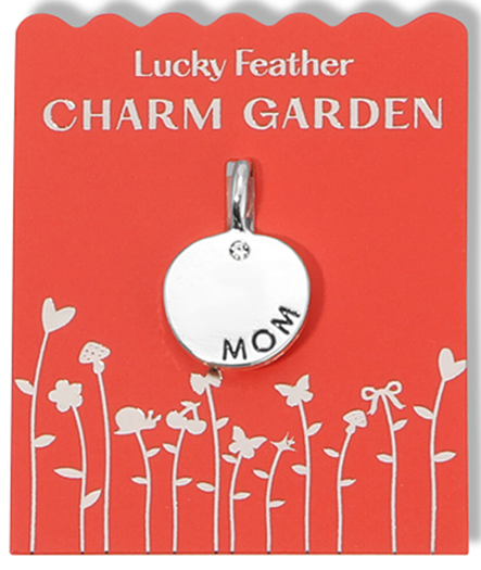 A Lucky Feather Charm Garden pendant that says "Mom" on a red card.