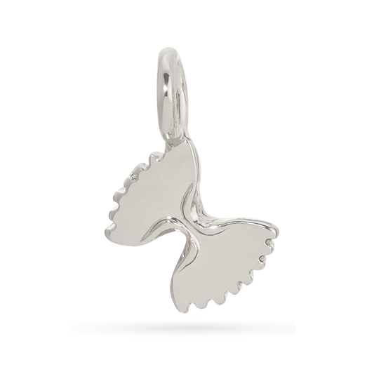 A silver whale tail pendant with a loop at the top is displayed.