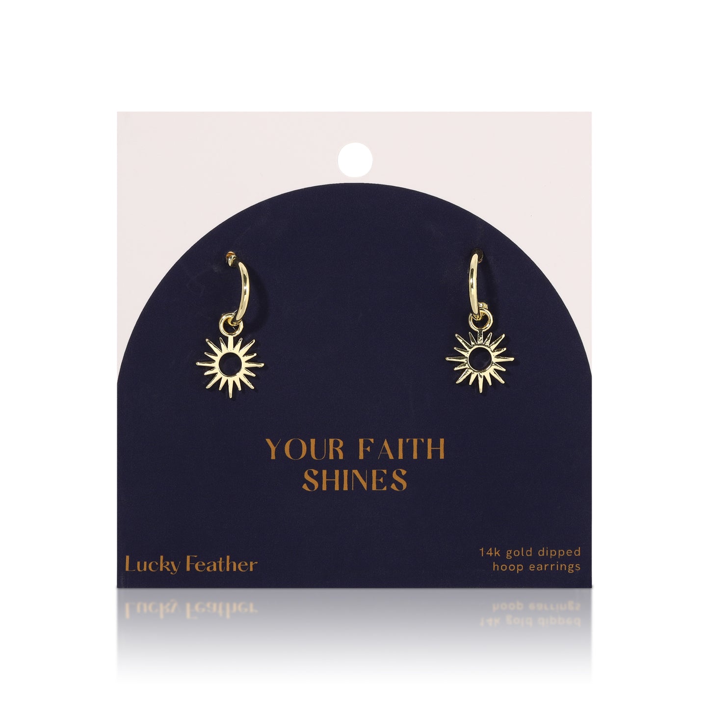 Gold-colored sun-shaped hoop earrings on a display card.