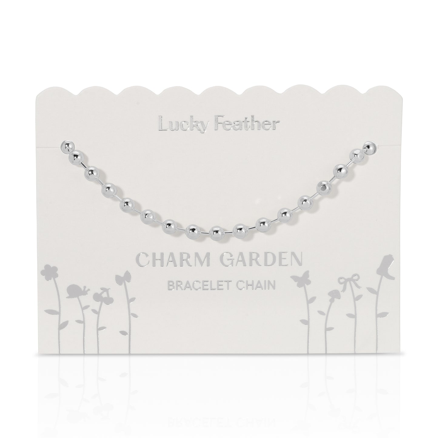 Silver beaded bracelet chain on a "Lucky Feather Charm Garden" display card.