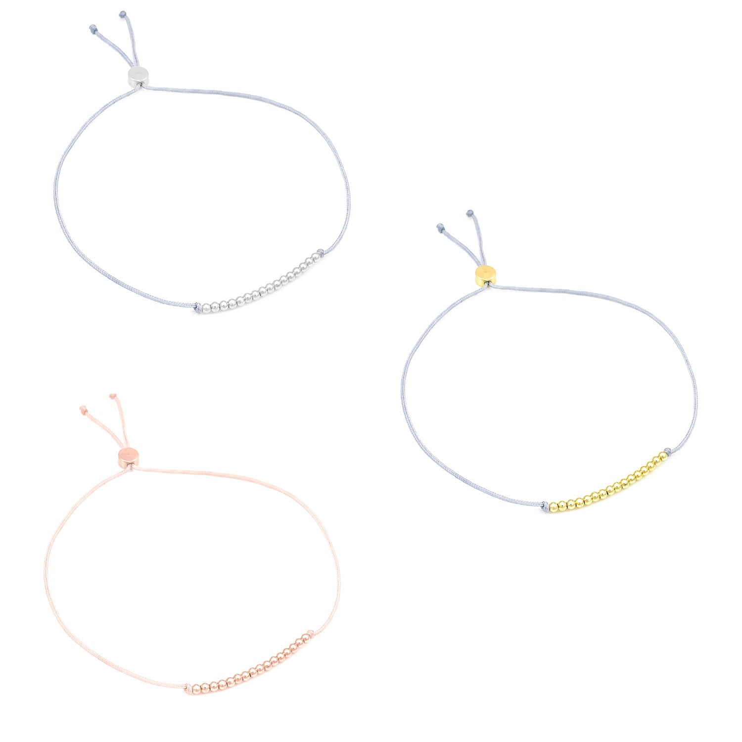 Three adjustable string bracelets with small metal beads on each.
