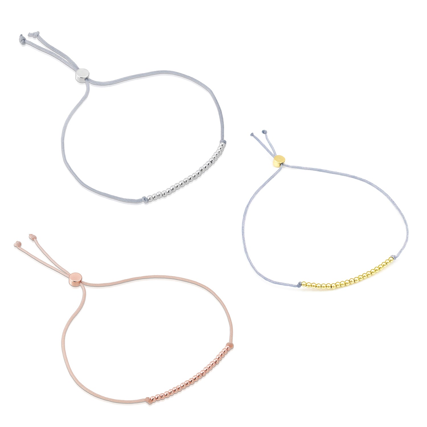 Three adjustable cord bracelets with metallic beads are displayed on a white surface.