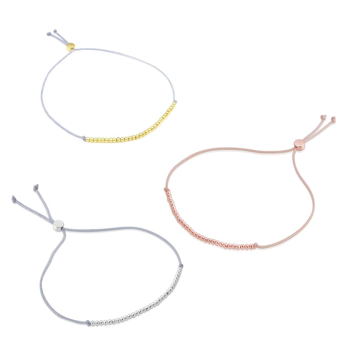 Three delicate cord bracelets are displayed, each featuring a row of metallic beads in silver, gold, and rose gold.