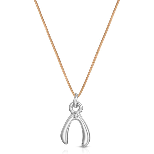 A silver wishbone pendant with a small stone hangs from a tan cord.