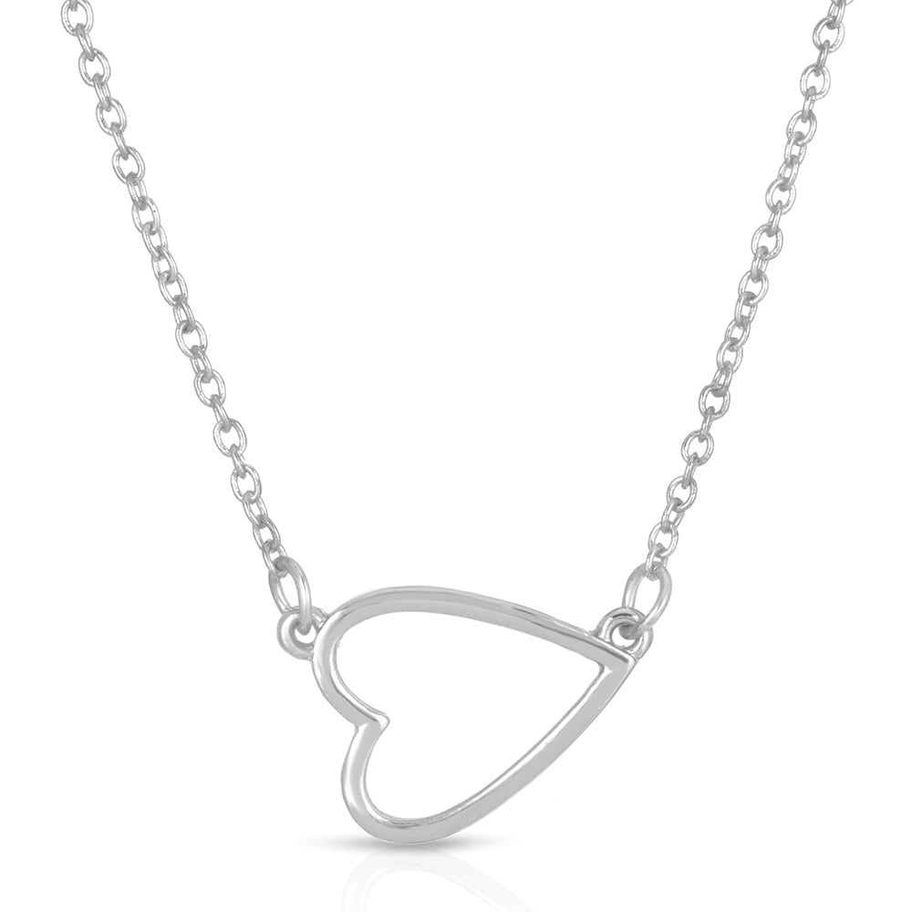 A silver chain necklace features a heart-shaped pendant.