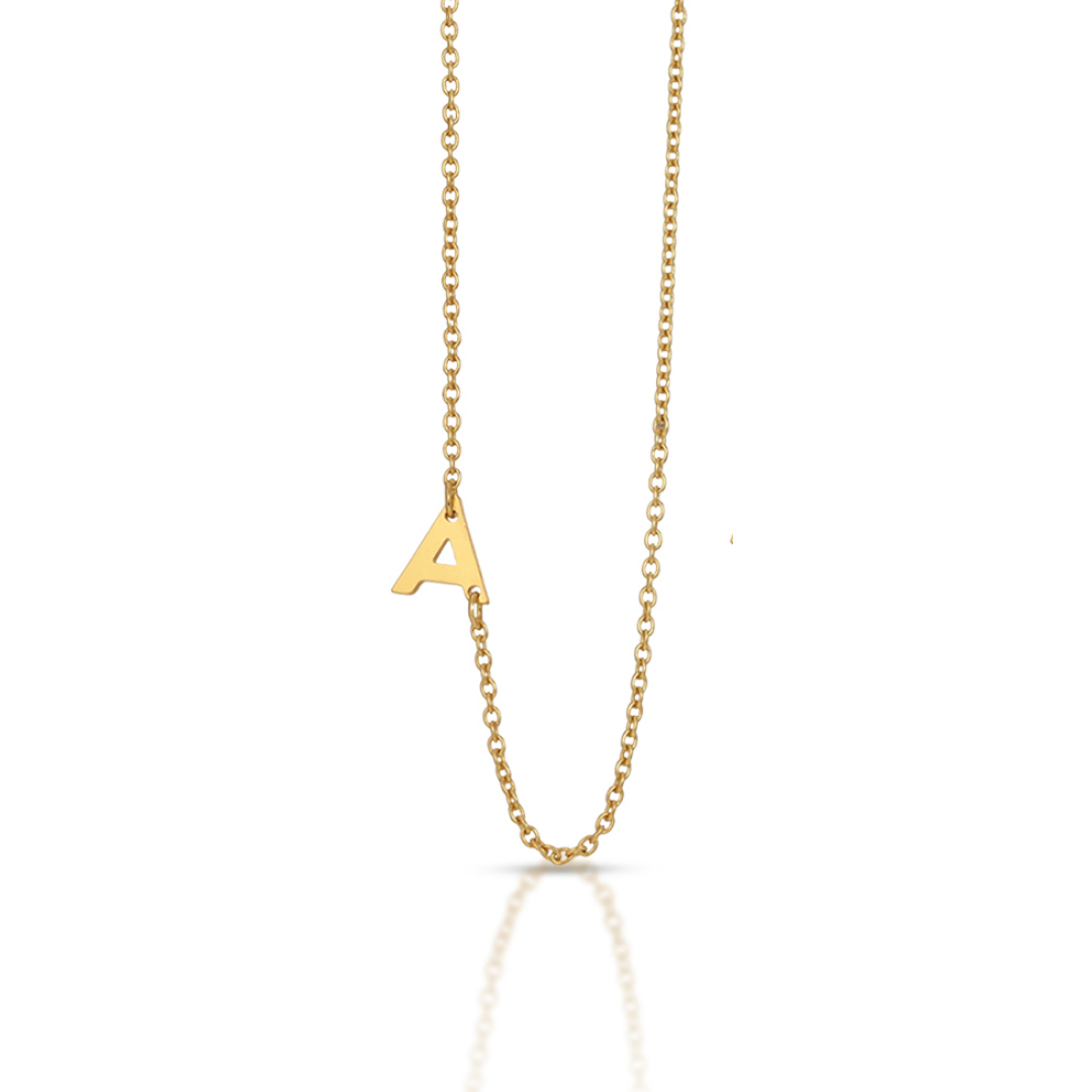 A gold chain necklace features a capital letter A pendant.