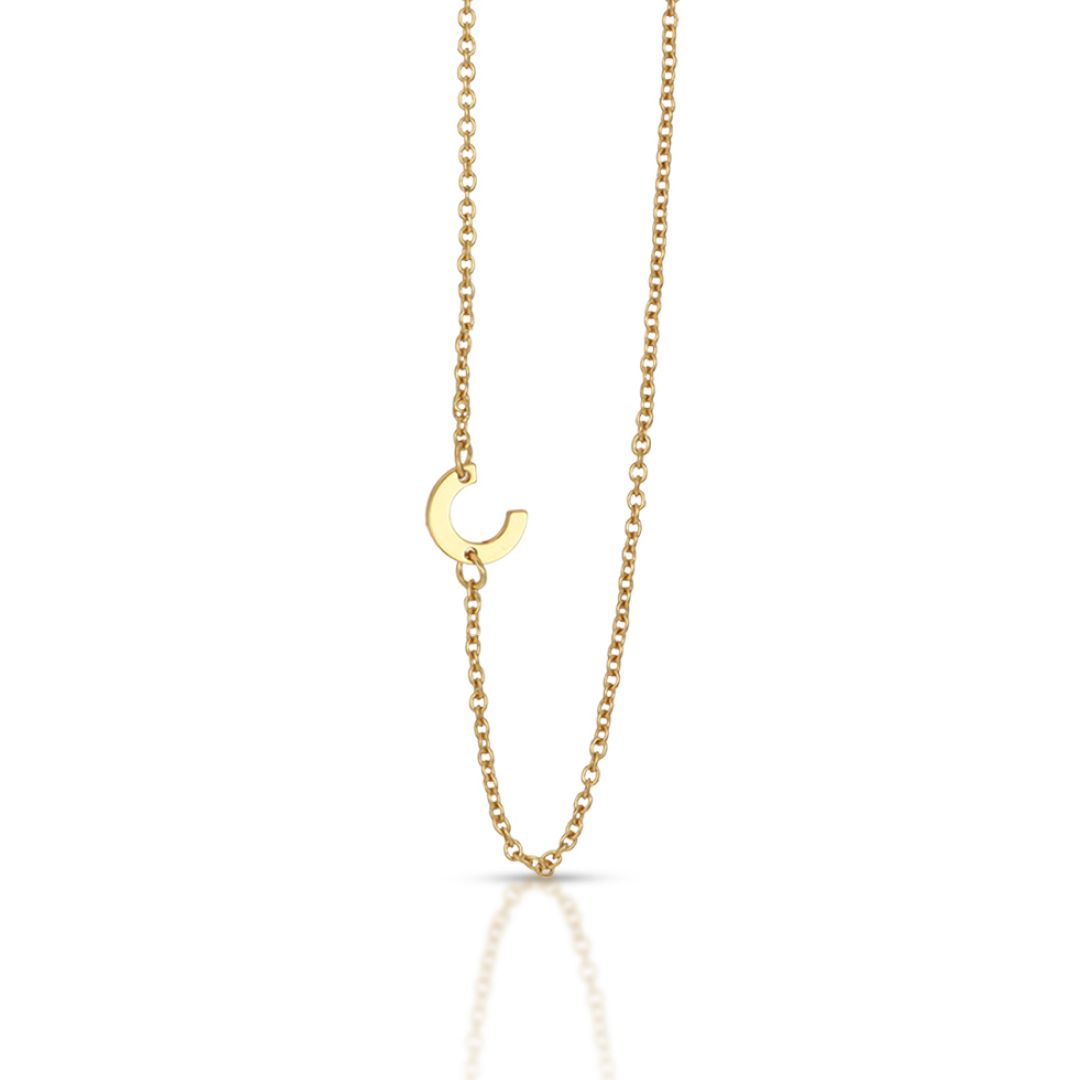 A gold chain necklace with a "C" pendant.
