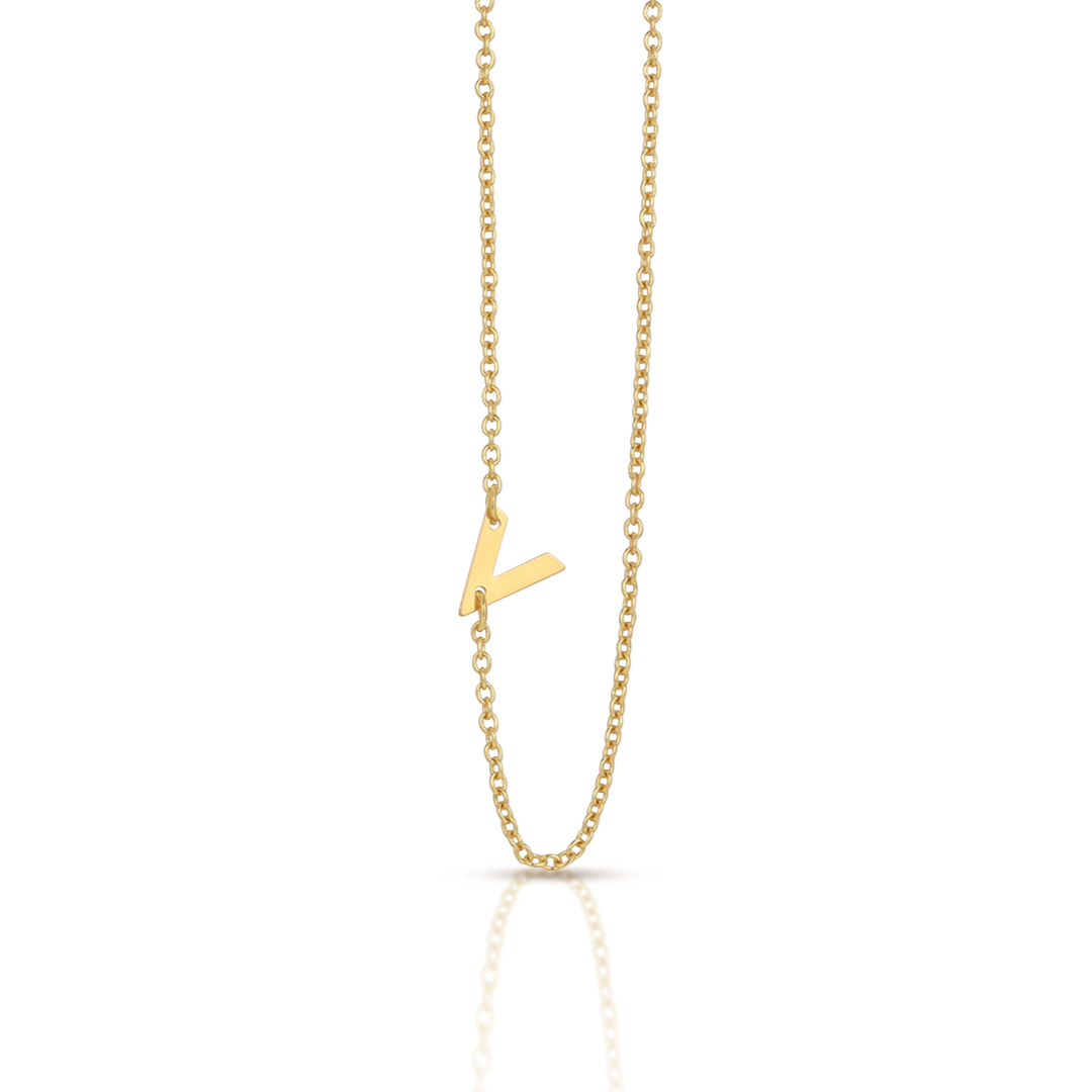 A gold chain necklace with a sideways letter "V" pendant.