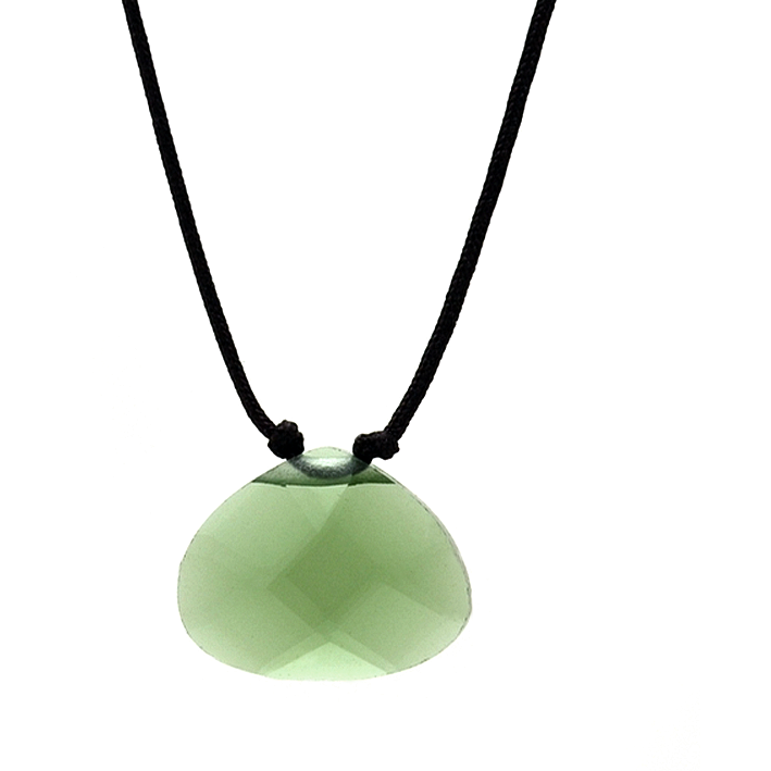 Close-up of a green stone pendant necklace with a black cord.