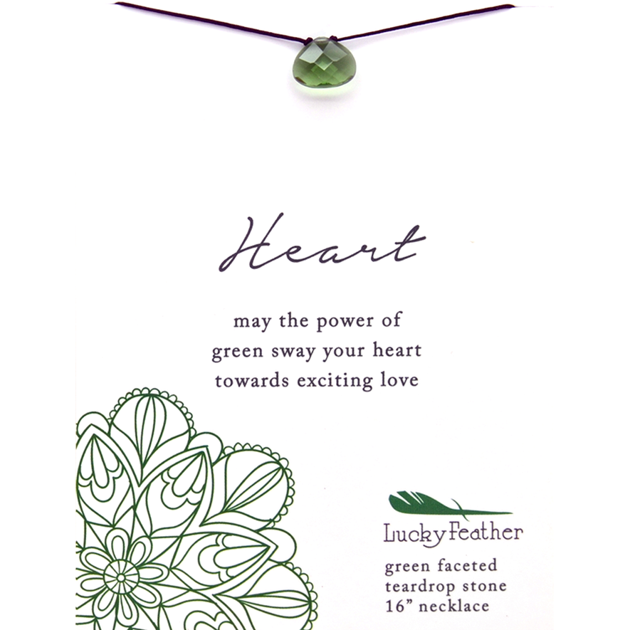 Close-up of a "Lucky Feather" necklace featuring a green faceted teardrop stone.