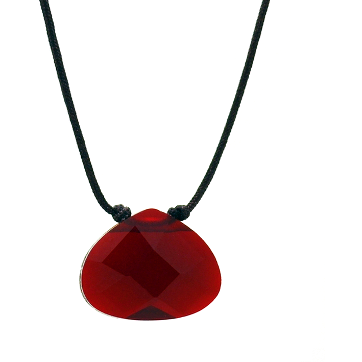 A red, faceted gemstone pendant hangs from a black cord.