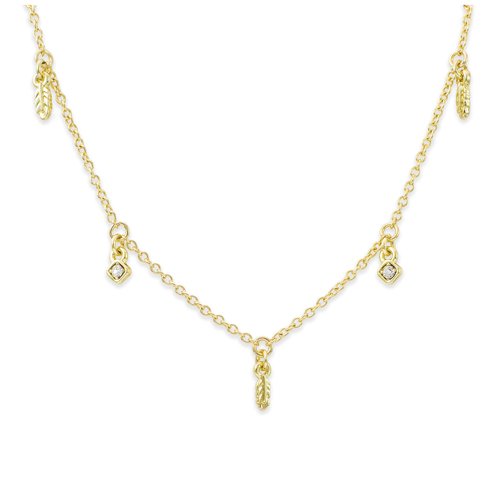 A delicate gold necklace with feather and diamond-shaped charms.