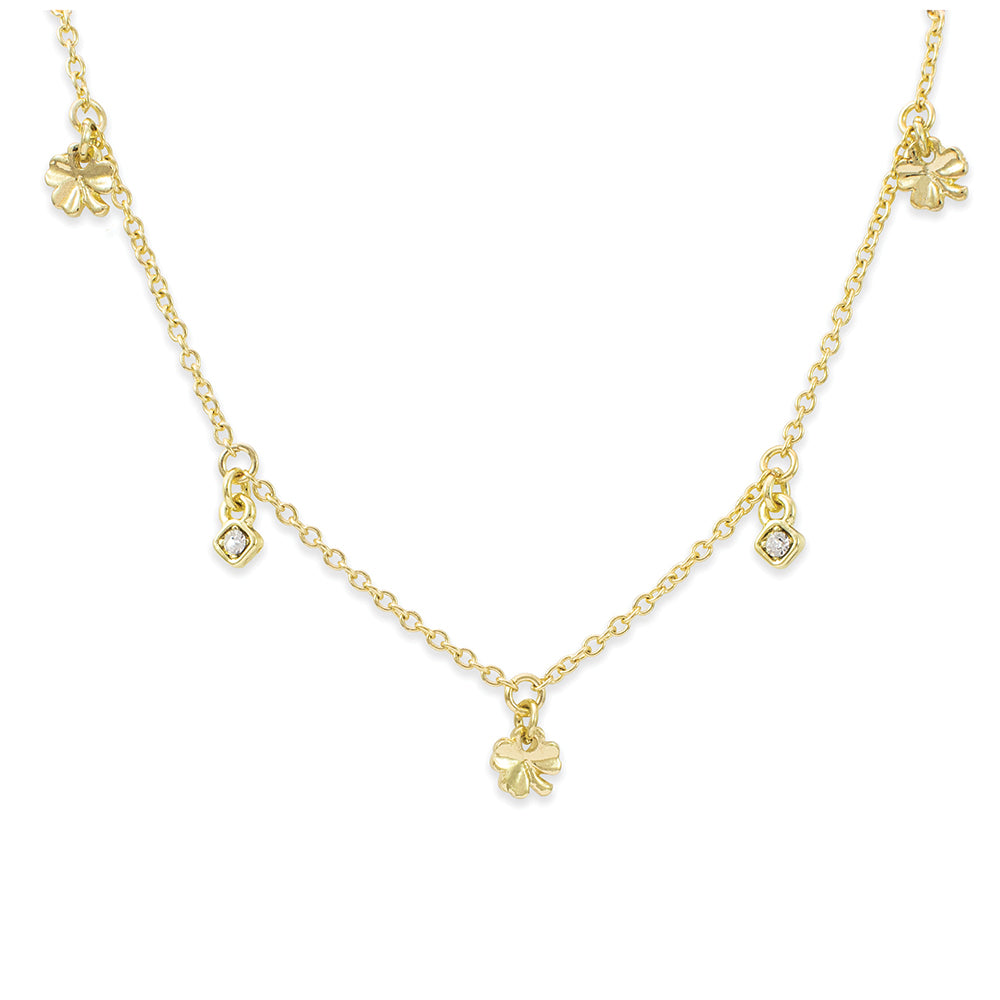 A gold chain necklace features clover and square charms.
