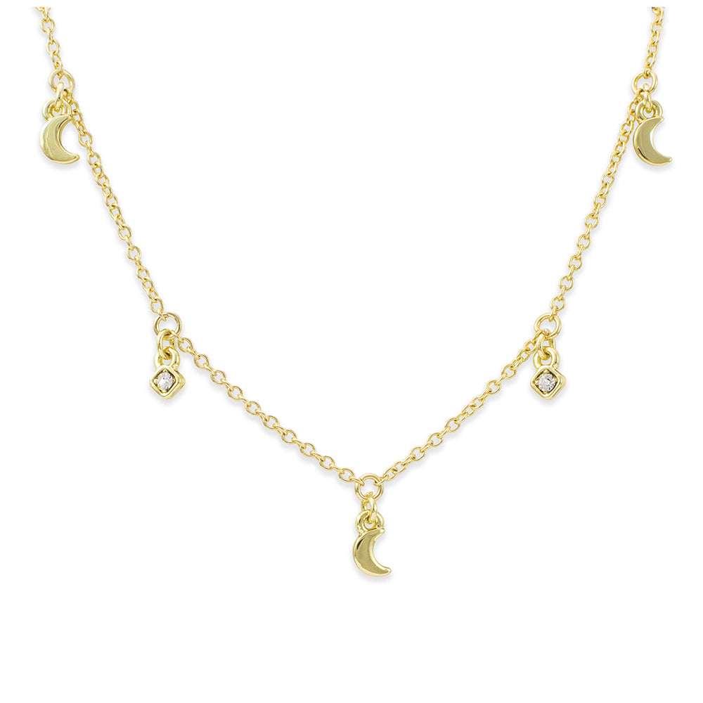 A gold necklace with moon and square charms.