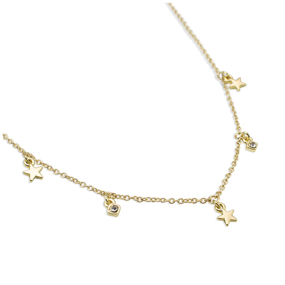 A gold chain necklace with star and gem charms.
