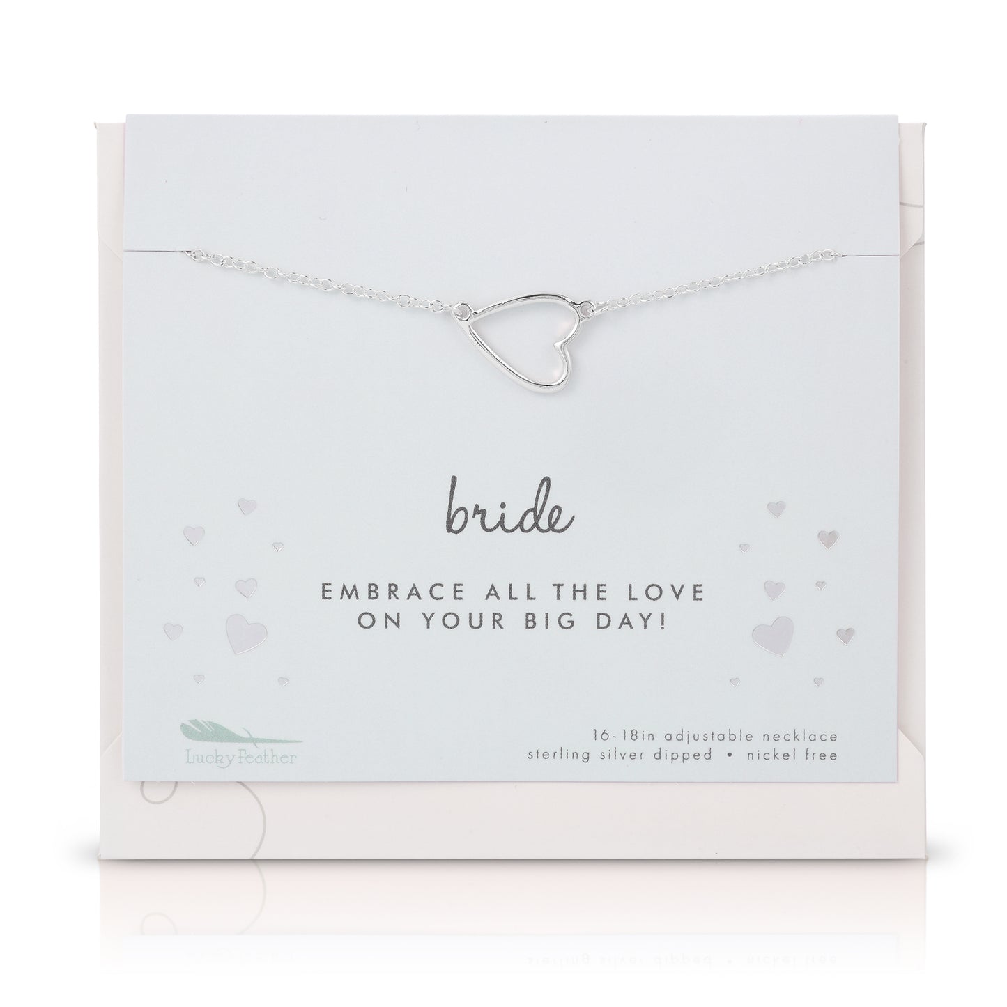 A silver heart pendant necklace on a "Bride" card from Lucky Feather.