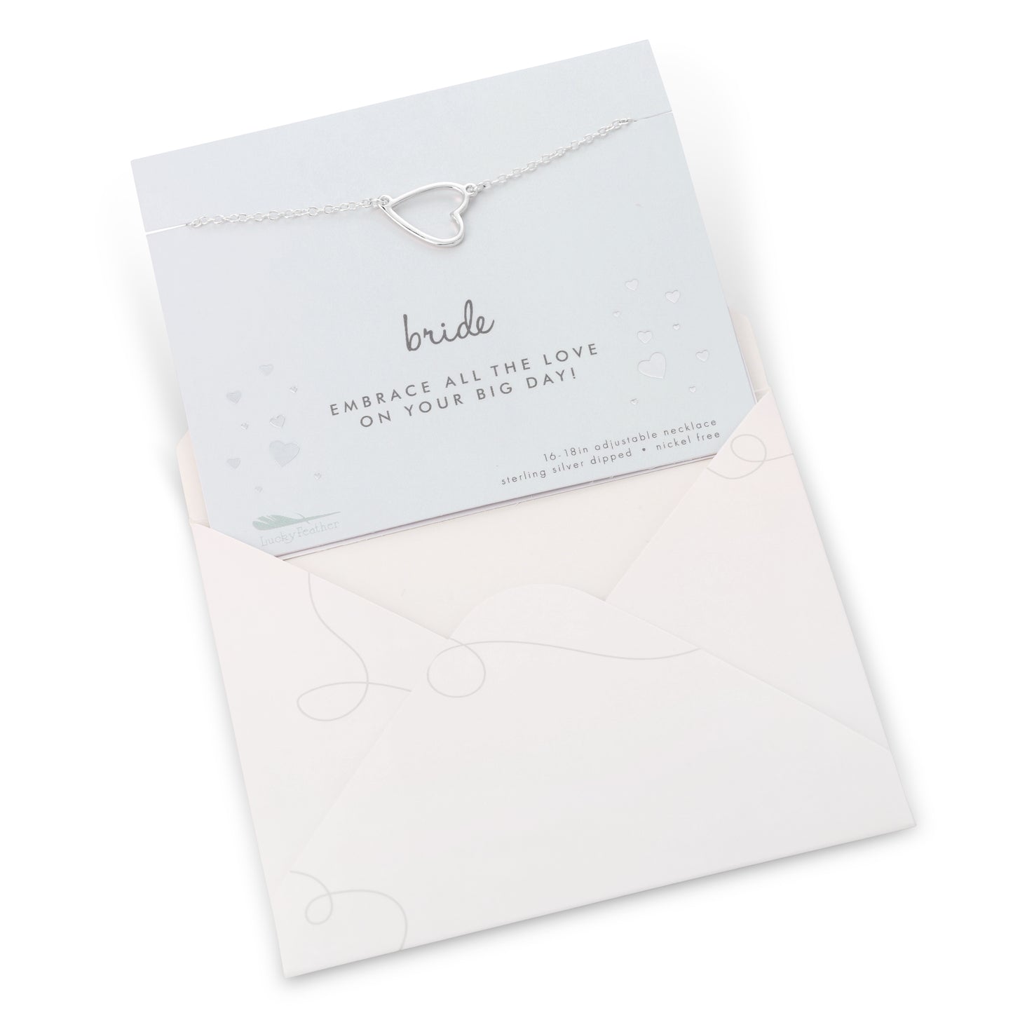 A sterling silver heart pendant necklace on a card for a bride in a light pink envelope.
