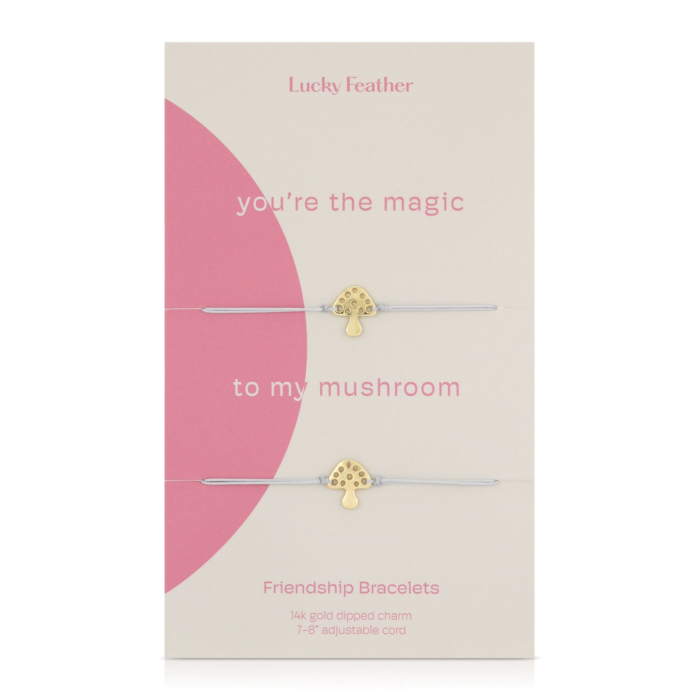 Two friendship bracelets with gold mushroom charms are displayed on a decorative card that reads "Lucky Feather."