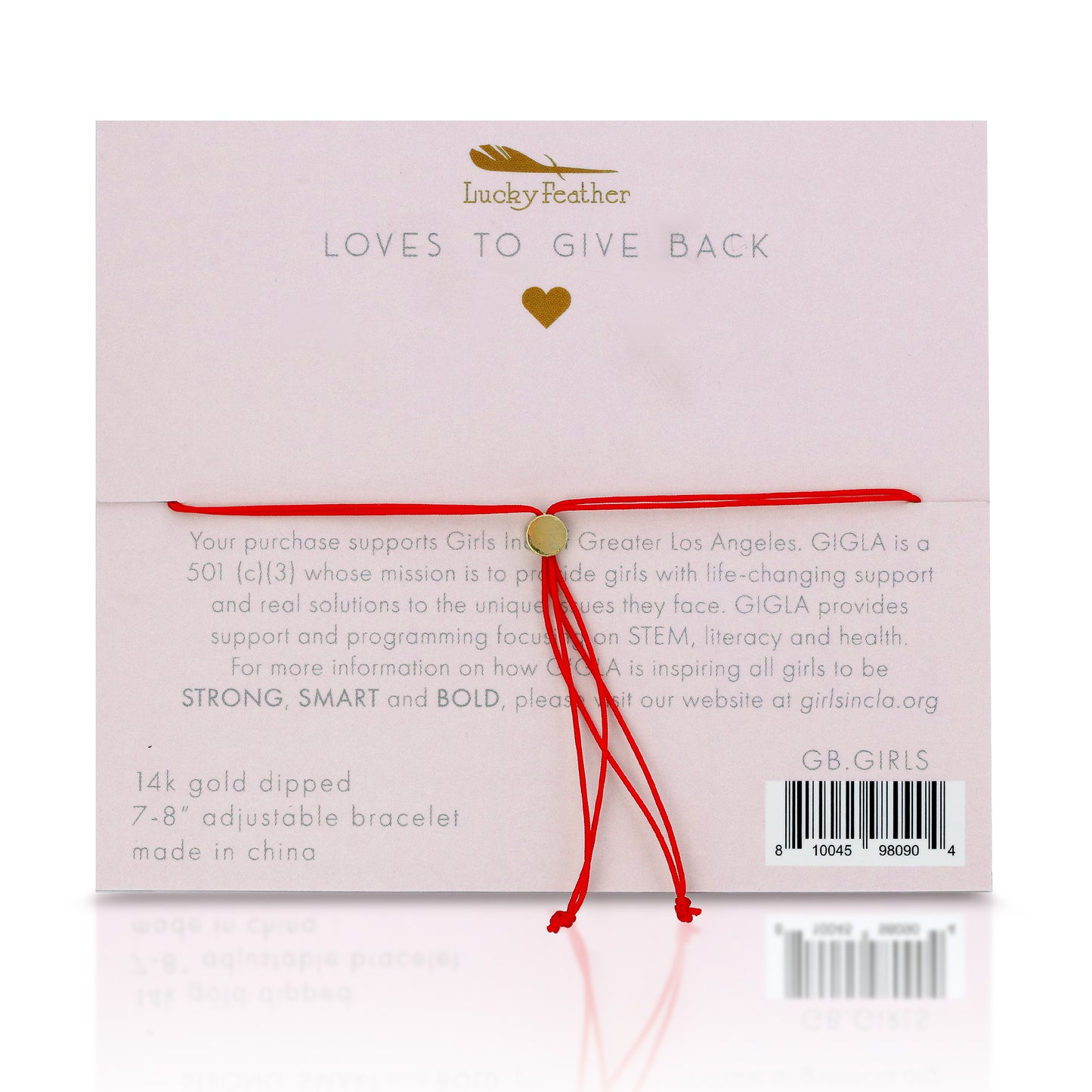 A "Lucky Feather" jewelry backing card with a red string bracelet attached.
