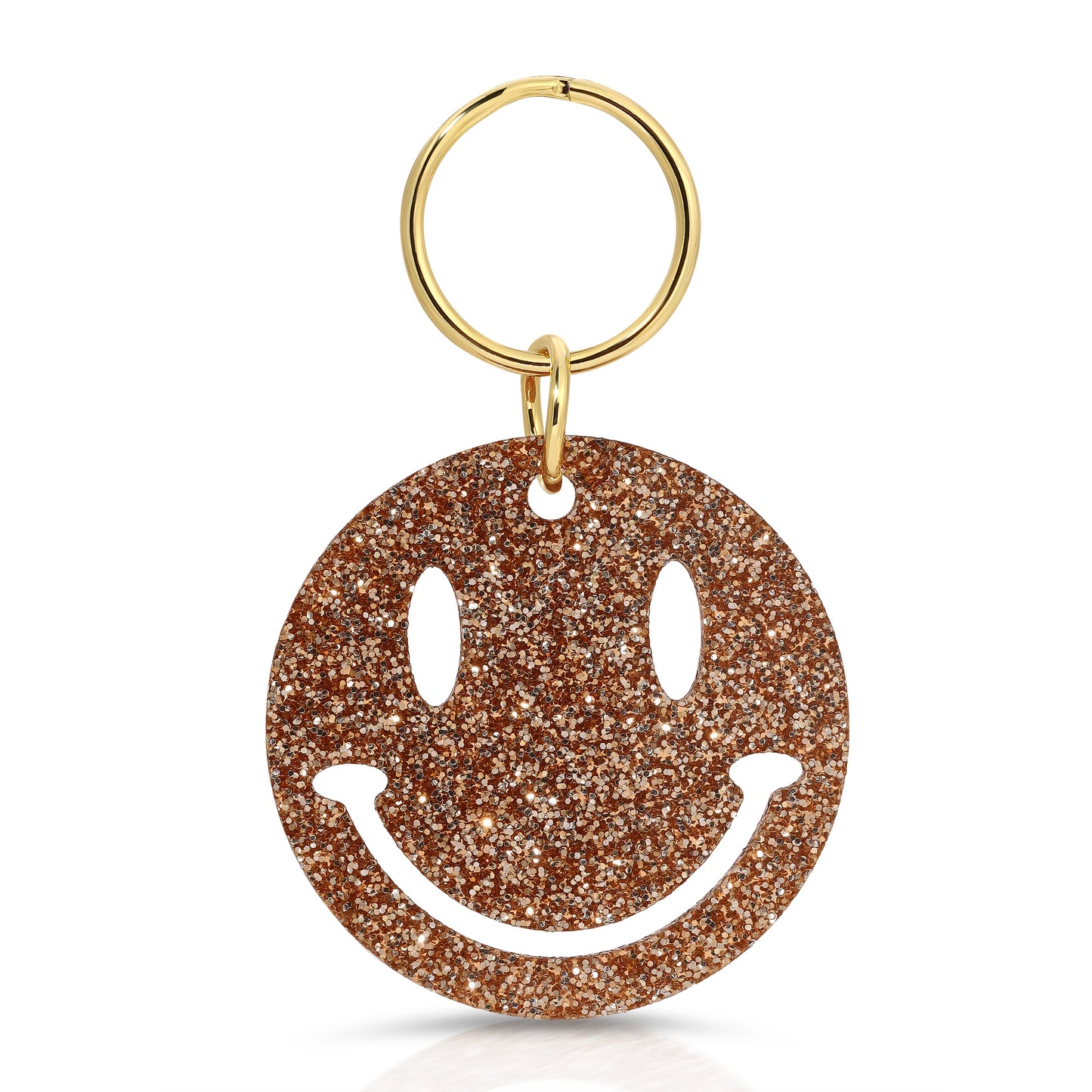 A glittery gold smiley face keyring on a white background.