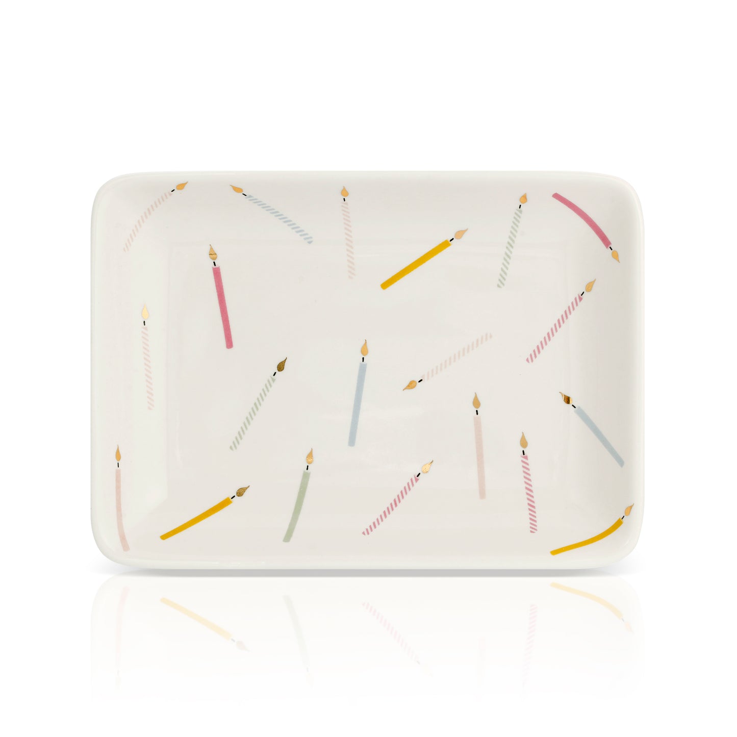A rectangular dish is decorated with an assortment of birthday candles.