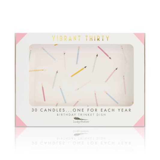 A "Vibrant Thirty" birthday trinket dish box features a window showing a design of scattered colorful candles.
