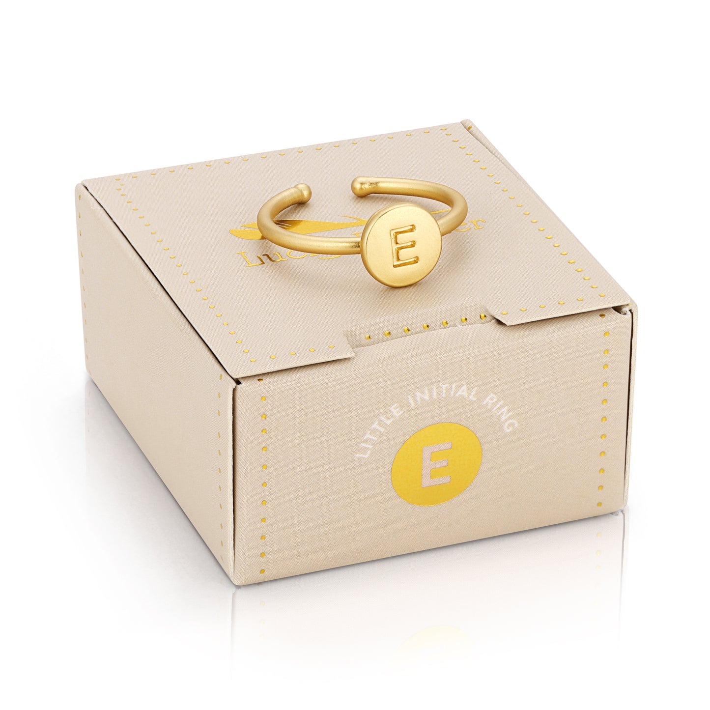 A gold-colored ring with the letter "E" sits atop a beige box labeled "LITTLE INITIAL RING."