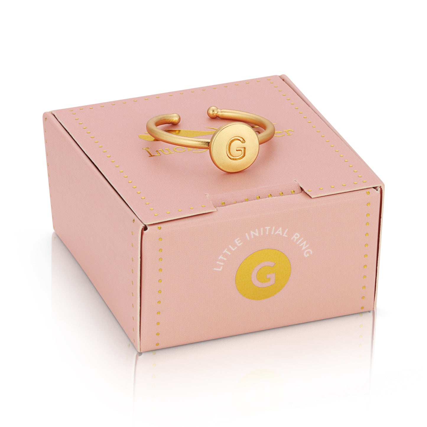A gold-colored ring with the letter "G" on a pink box labeled "LITTLE INITIAL RING."